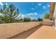 Expansive balcony provides an outdoor retreat with beautiful views of the lush surrounding greenery and the bright sky at 1923 E Drake Dr, Tempe, AZ 85283