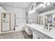 Elegant bathroom with double sinks, a soaking tub, and a walk-in shower with glass door at 1923 E Drake Dr, Tempe, AZ 85283