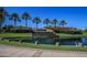 Picturesque view of the ASU Research Park featuring a waterfall and lush palm trees at 1923 E Drake Dr, Tempe, AZ 85283