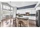 Modern kitchen featuring white cabinets, stainless steel appliances, and a raised breakfast bar at 1923 E Drake Dr, Tempe, AZ 85283