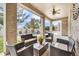 Relaxing covered patio featuring stylish outdoor furniture and views of the backyard pool area at 1923 E Drake Dr, Tempe, AZ 85283