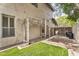 Side yard featuring a trellis, gate, and well-maintained lawn offering a serene outdoor space at 1923 E Drake Dr, Tempe, AZ 85283