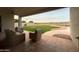 Covered patio overlooking a grassy backyard with a pool at 2332 E Nora St, Mesa, AZ 85213