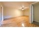 Spacious basement with hardwood floors and ceiling fan at 2332 E Nora St, Mesa, AZ 85213