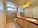 Double vanity bathroom with large shower and tile flooring at 2332 E Nora St, Mesa, AZ 85213