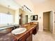 Large bathroom with double sinks, granite countertop, and elegant chandelier at 2332 E Nora St, Mesa, AZ 85213