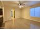 Bright bedroom featuring granite flooring and access to a bathroom at 2332 E Nora St, Mesa, AZ 85213
