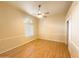 Bedroom with hardwood floors, ceiling fan, and window blinds at 2332 E Nora St, Mesa, AZ 85213