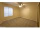 Bedroom with neutral walls, carpet flooring, and ceiling fan at 2332 E Nora St, Mesa, AZ 85213