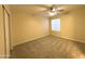 Bright bedroom with neutral walls and carpet flooring at 2332 E Nora St, Mesa, AZ 85213