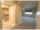 Spacious bedroom with mirrored closet doors and neutral carpeting at 2332 E Nora St, Mesa, AZ 85213