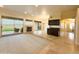 Spacious living area with fireplace, large windows, and access to a patio at 2332 E Nora St, Mesa, AZ 85213