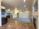 Open living space with tile floors, fireplace, and wet bar at 2332 E Nora St, Mesa, AZ 85213