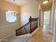 Elegant staircase with wooden railing and chandelier at 2332 E Nora St, Mesa, AZ 85213