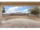 Large backyard features a spacious patio, block wall, and ample space for outdoor activities at 2338 N 112Th Ln, Avondale, AZ 85392
