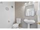 Charming half bath featuring an elegant sink and stylish vanity with lovely decor at 2338 N 112Th Ln, Avondale, AZ 85392