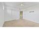 This is a bedroom featuring neutral-toned walls, carpet flooring, and a white ceiling fan at 2338 N 112Th Ln, Avondale, AZ 85392