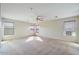 Spacious bedroom features neutral carpet, a ceiling fan, and lots of natural light at 2338 N 112Th Ln, Avondale, AZ 85392