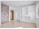 Spacious living room offers tile floors, and accent wall, and bright white paint at 2338 N 112Th Ln, Avondale, AZ 85392