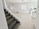 Cozy living space with staircase and a view of the kitchen; lots of natural light at 2338 N 112Th Ln, Avondale, AZ 85392