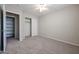 Bedroom with ceiling fan, closet, and additional shelving at 24201 W Lasso Ln, Buckeye, AZ 85326