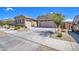 Two-car garage, desert landscaping, and curb appeal at 24393 N 169Th Dr, Surprise, AZ 85387