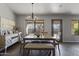 Dining area with a chandelier and sliding door to backyard at 25671 W Miami St, Buckeye, AZ 85326