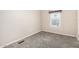 Simple bedroom with window and carpet at 2650 W Union Hills Dr # 231, Phoenix, AZ 85027