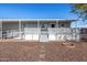 Gray mobile home with covered porch and ramp access at 2650 W Union Hills Dr # 231, Phoenix, AZ 85027