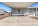 Gray mobile home with covered carport and ramp at 2650 W Union Hills Dr # 231, Phoenix, AZ 85027