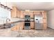 Light wood kitchen cabinets, stainless steel appliances at 2650 W Union Hills Dr # 231, Phoenix, AZ 85027