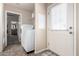 Laundry room with washer, dryer, and exterior access at 2650 W Union Hills Dr # 231, Phoenix, AZ 85027