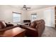 Living room with brown leather couches and a coffee table at 2650 W Union Hills Dr # 231, Phoenix, AZ 85027
