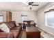 Living room with brown leather couches and wood coffee table at 2650 W Union Hills Dr # 231, Phoenix, AZ 85027