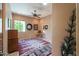 Bright bedroom with a ceiling fan, window, and decorative rug at 2728 N Meridian Rd, Apache Junction, AZ 85120