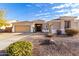 House with a two-car garage and desert landscaping at 2970 E Brooks St, Gilbert, AZ 85296