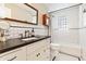 Charming bathroom with a tiled shower, dark countertop, mosaic floors, and dark hardware at 3048 N 45Th St, Phoenix, AZ 85018
