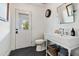 Bright bathroom with shiplap walls, dark herringbone floors, and modern fixtures at 3048 N 45Th St, Phoenix, AZ 85018