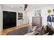 Bedroom with wooden floors, a ceiling fan, a chest, and built-in shelving with closet at 3048 N 45Th St, Phoenix, AZ 85018