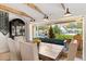Dining area with a wooden table and view of the backyard's pool, fireplace, and patio at 3048 N 45Th St, Phoenix, AZ 85018