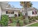 Inviting front porch with swing, brick accents, manicured landscaping and an American flag at 3048 N 45Th St, Phoenix, AZ 85018