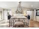 Elegant main bedroom with vaulted ceiling, chandelier, and access to ensuite bathroom at 3048 N 45Th St, Phoenix, AZ 85018