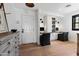 Bright home office space with built-in desks and shelving, wood floors and a large window at 3048 N 45Th St, Phoenix, AZ 85018