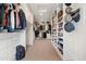 Large walk-in closet with custom built-in shelving and drawers for optimal organization at 3048 N 45Th St, Phoenix, AZ 85018