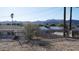 Large backyard with a view of neighboring homes and mountains at 327 W Fairhaven Rd, Kearny, AZ 85137
