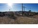 Large backyard with a view of neighboring homes and mountains at 327 W Fairhaven Rd, Kearny, AZ 85137