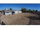 Large backyard with a view of neighboring homes and mountains at 327 W Fairhaven Rd, Kearny, AZ 85137