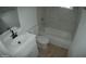 Updated bathroom with white vanity, bathtub, and modern fixtures at 327 W Fairhaven Rd, Kearny, AZ 85137