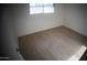 Bright bedroom featuring light gray vinyl plank flooring at 327 W Fairhaven Rd, Kearny, AZ 85137