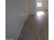 Bright and airy living room with light gray vinyl plank flooring at 327 W Fairhaven Rd, Kearny, AZ 85137